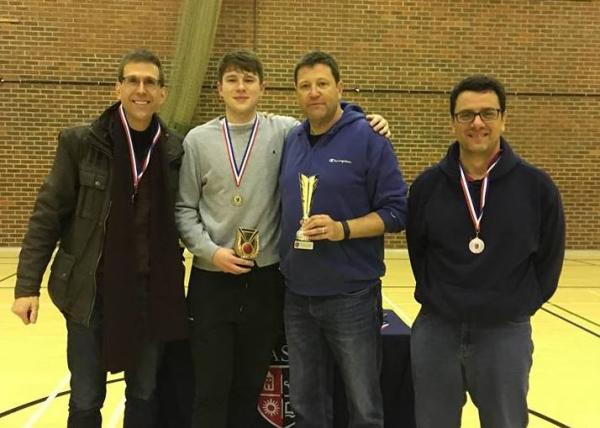 Ben Sammon (pictured here with his three coaches) was chosen as a tournament Top 5 player